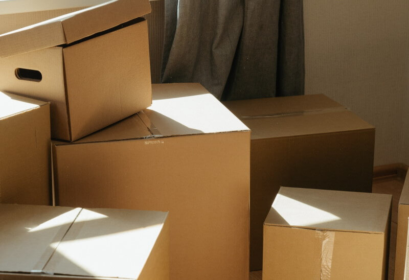 Packed boxes waiting for removal when house sale has fallen through